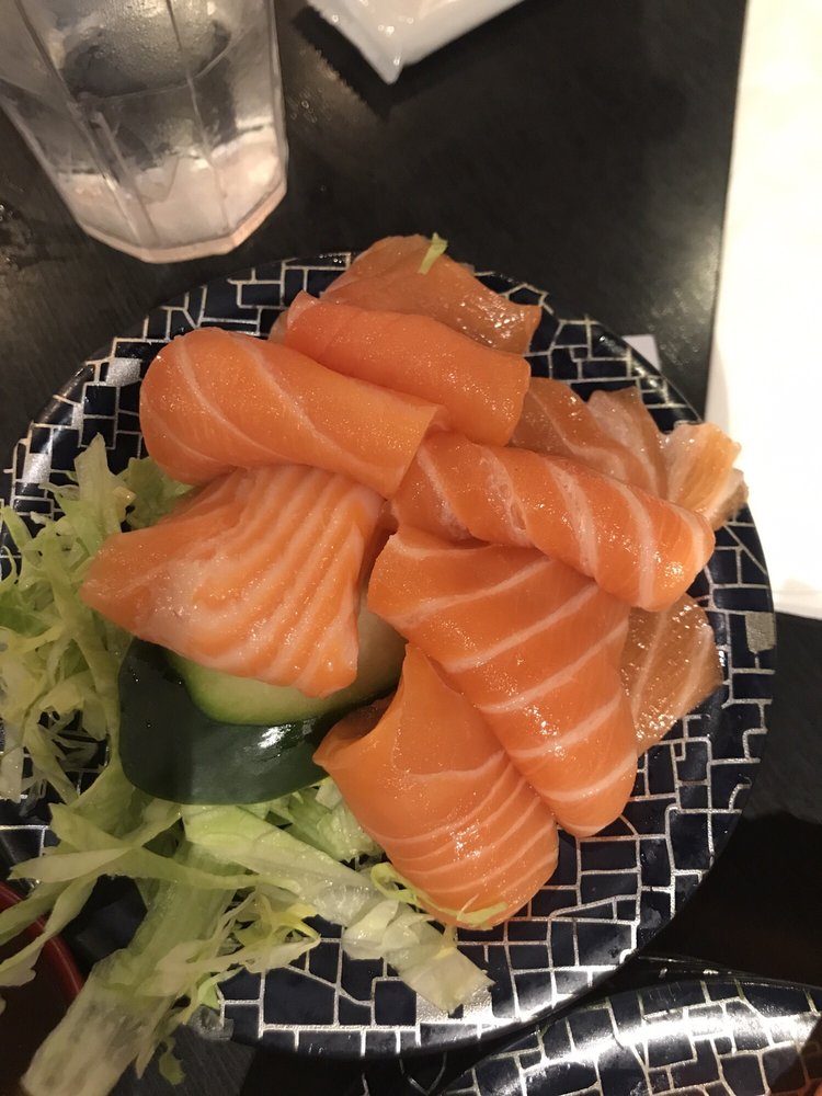 Salmon sashimi on shredded lettuce