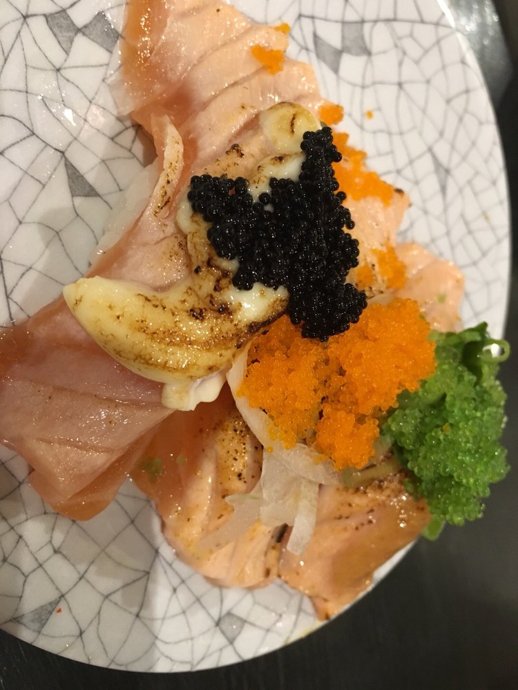 Seared salmon topped with black and orange fish roe