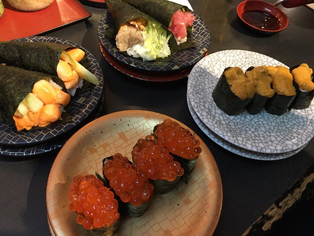 Plates of salmon roe, sea urchin and hand rolls